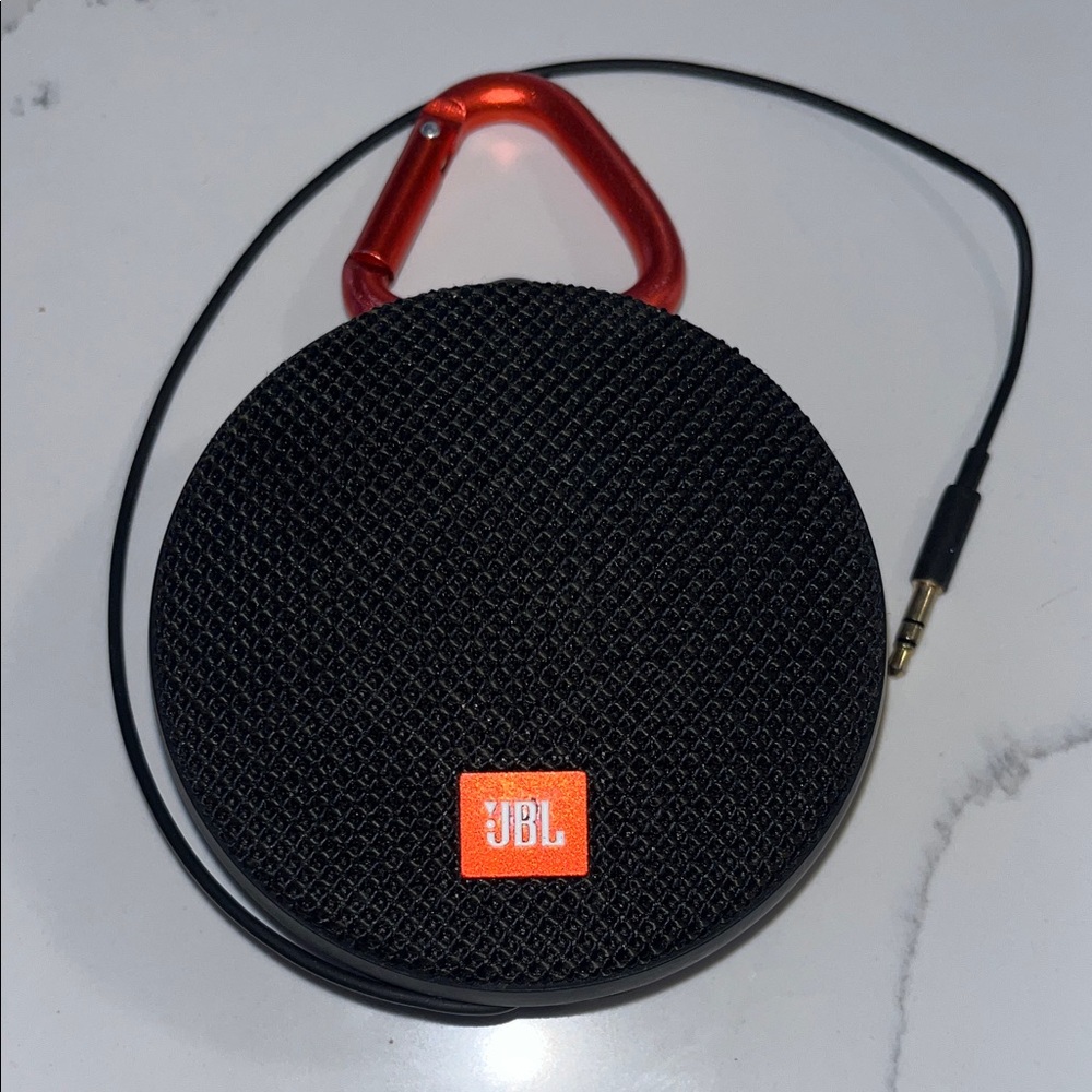 JBL Black Portable Round Bluetooth Speaker with Red Carabiner Accent